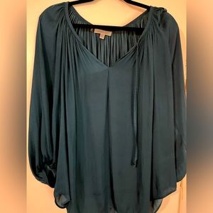 Jennifer Lopez teal blouse.